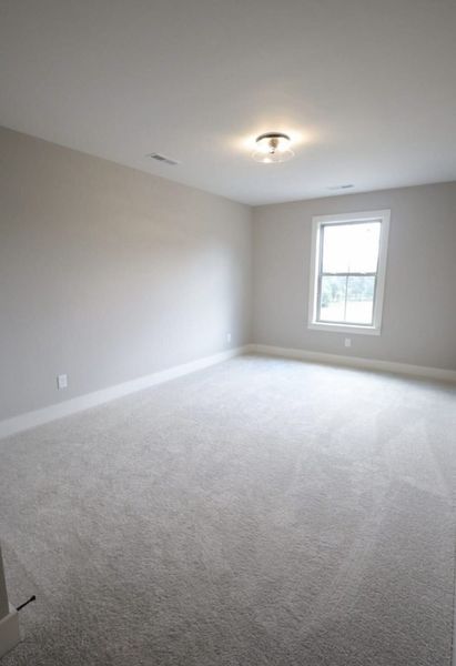 Spacious, unfurnished interior of a new home in Baker Road, Birchwood (Image 55).