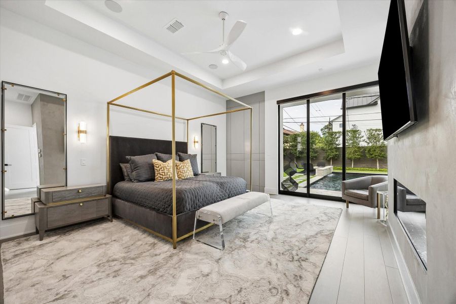 Primary Bedroom with access to the outdoors. Floor to ceiling woodwork with brass inlay that is currently being used as suitcase storage. Primary Bedroom with access to the outdoors. Floor to ceiling woodwork with brass inlay that is currently being used as suitcase storage.