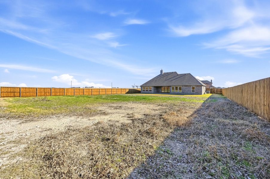 Front exterior of a new home in Coyote Crossing, Godley, TX, highlighting curb appeal (Image 25).