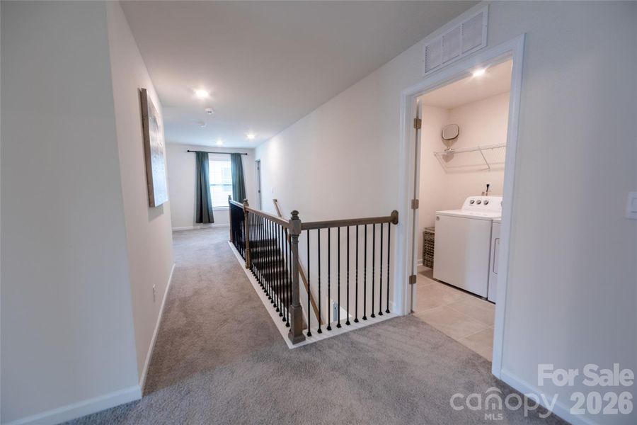 Thoughtfully positioned laundry room for effortless use.