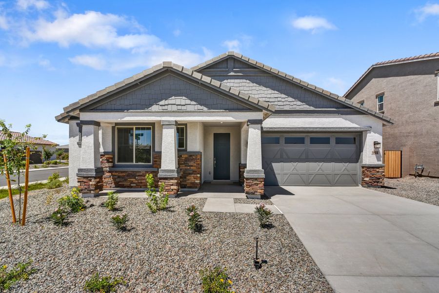 Front exterior of a new home in Tirreno at IronWing, Litchfield Park, AZ, highlighting curb appeal (Image 1). Front exterior of a new home in Tirreno at IronWing, Litchfield Park, AZ, highlighting curb appeal (Image 1).