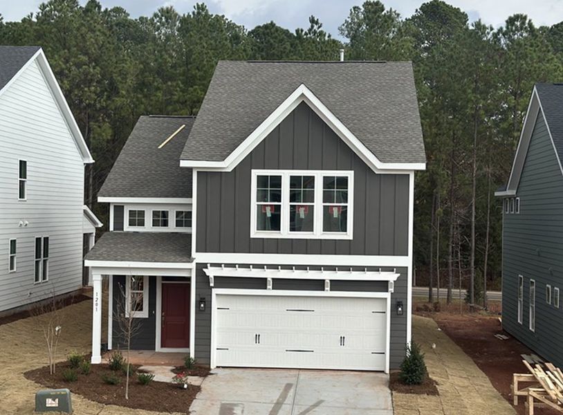 Front exterior of a new home in Sweetbrier, Durham, NC, highlighting curb appeal (Image 1).