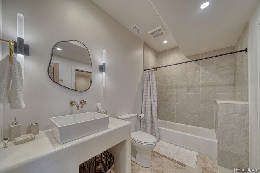 An additional guest bath with access from the fitness studio and sixth bedroom. An additional guest bath with access from the fitness studio and sixth bedroom.