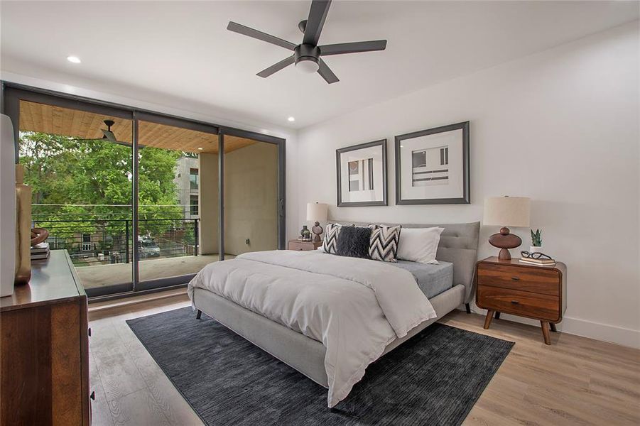 Bedroom featuring light wood-type flooring, ceiling fan, and access to outside