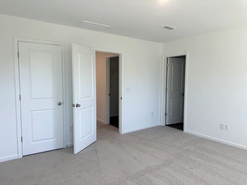 Primary Bed - A sophisticated retreat with style. Primary Bed - A sophisticated retreat with style.