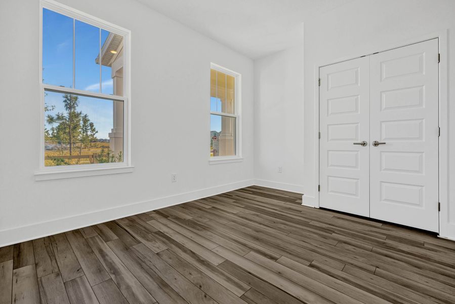 Spacious, unfurnished interior of a new home in Harvest at Ovation - Townhomes, Winter Garden (Image 15).