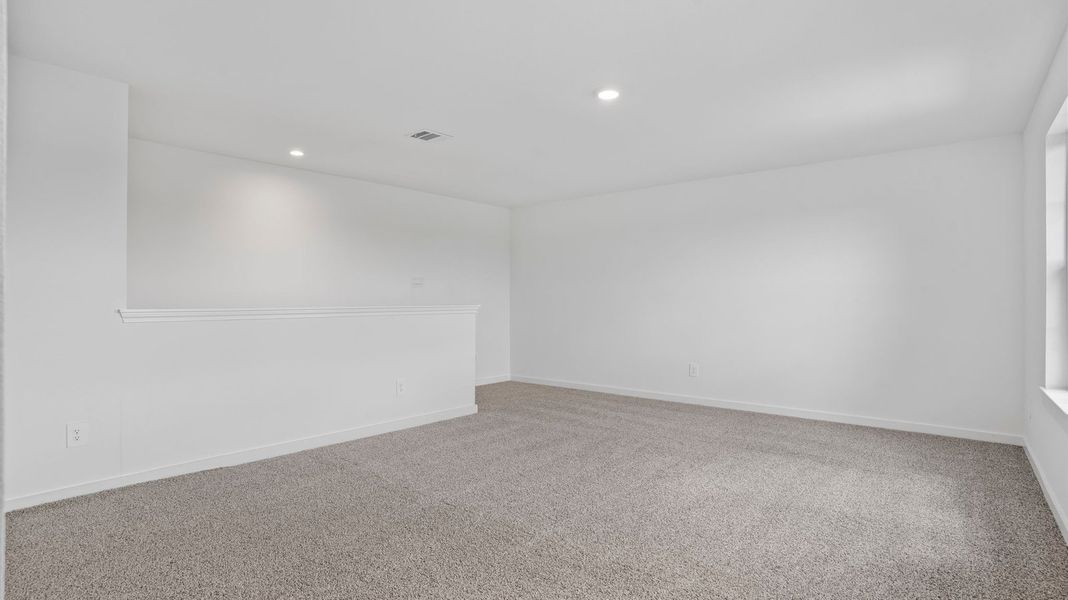 Representative unfurnished interior of a home built from the Mitchell by D.R. Horton in Caldwell Crossing, Iowa Colony (Image 20).