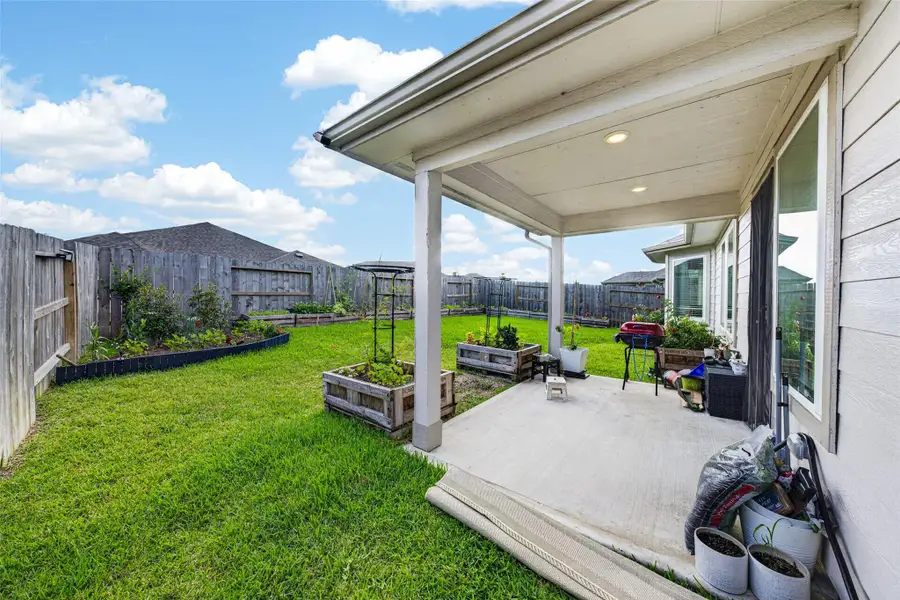 Exterior details and patio area of a home in Wall Street Village, Richmond (Image 4).