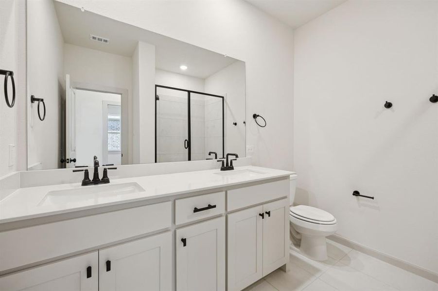 Friends and family will feel right at home in either of the beautifully finished guest baths in our Giselle plan. Friends and family will feel right at home in either of the beautifully finished guest baths in our Giselle plan.