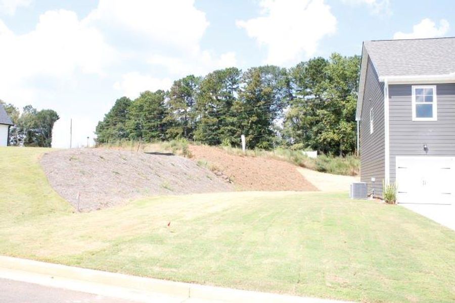 Front exterior of a new home in , Commerce, GA, highlighting curb appeal (Image 17).