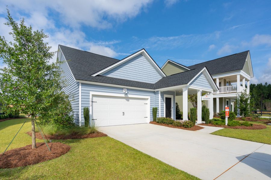Front exterior of a new home in Sweetgrass at Summers Corner: Carolina Collection, Summerville, SC, highlighting curb appeal (Image 1). Front exterior of a new home in Sweetgrass at Summers Corner: Carolina Collection, Summerville, SC, highlighting curb appeal (Image 1).