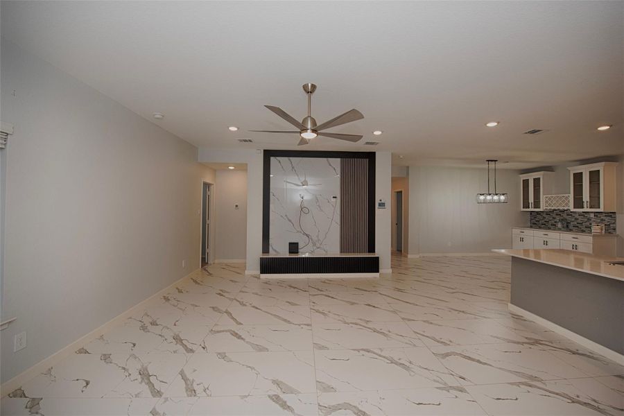 Family room has plenty of room for a large sectional sofa and room to spare. Family room has plenty of room for a large sectional sofa and room to spare.