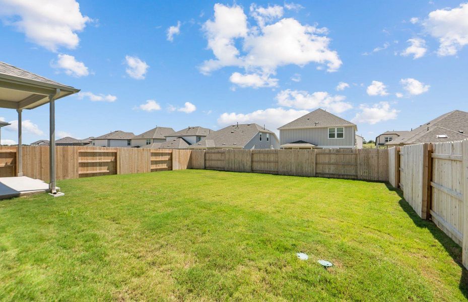Front exterior of a new home in Patterson Ranch, Georgetown, TX, highlighting curb appeal (Image 14). Front exterior of a new home in Patterson Ranch, Georgetown, TX, highlighting curb appeal (Image 14).