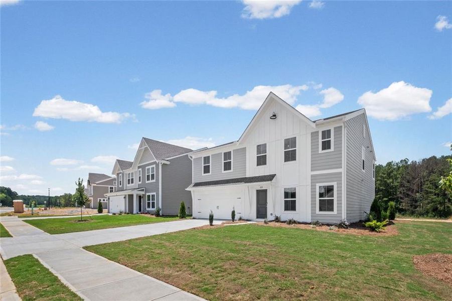 Front exterior of a new home in Three Rivers, Rome, GA, highlighting curb appeal (Image 16). Front exterior of a new home in Three Rivers, Rome, GA, highlighting curb appeal (Image 16).
