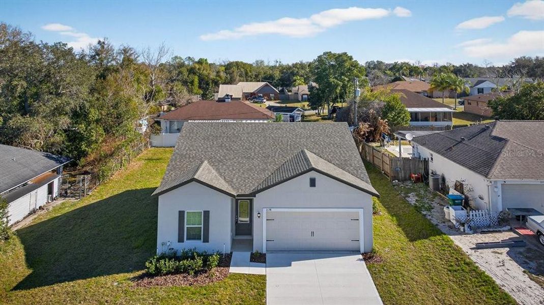 Front exterior of a new home in , Deltona, FL, highlighting curb appeal (Image 22). Front exterior of a new home in , Deltona, FL, highlighting curb appeal (Image 22).