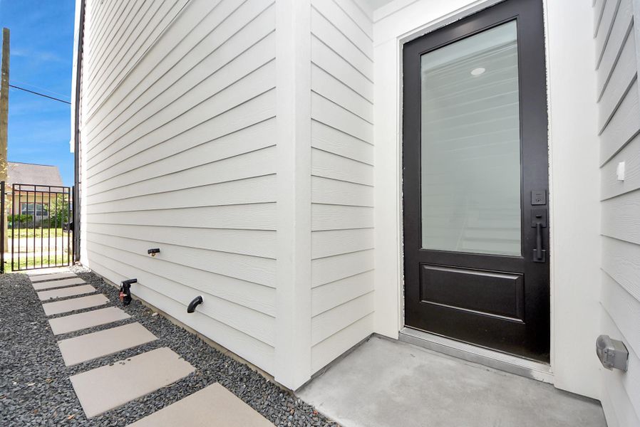 Exterior details and patio area of a home in Skyline Homes at Cavalcade, Houston (Image 3). Exterior details and patio area of a home in Skyline Homes at Cavalcade, Houston (Image 3).