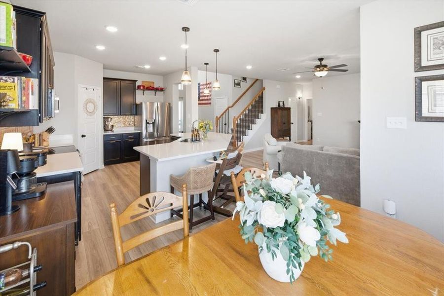 Dining area with light wood finished floors, and recessed lighting Dining area with light wood finished floors, and recessed lighting