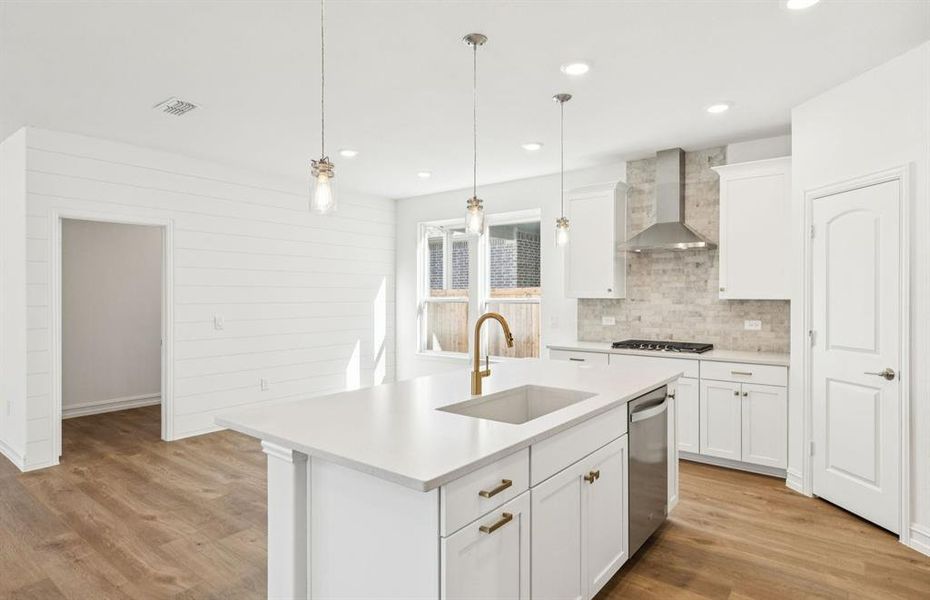 Dining nook off kitchen with large windows