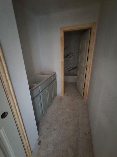 Full bathroom featuring vanity and a bath