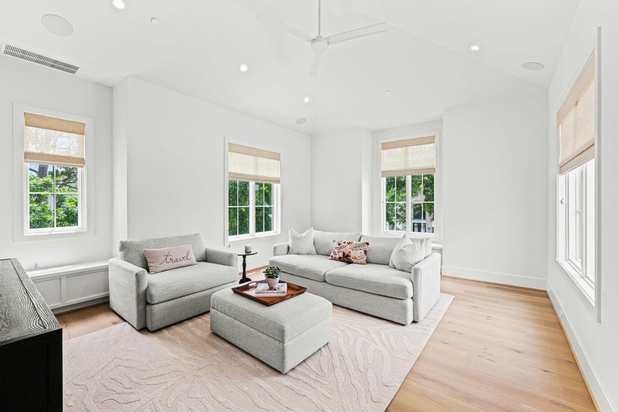 Located on the second floor, this versatile game & media room offers an open, airy feel w/ a vaulted ceiling & wide-plank white oak flooring. French door entry creates a defined yet connected space, while Sonos ceiling speakers, custom woven Roman shades & built-in window seats w/ storage below add both comfort & functionality—ideal for entertaining & everyday use. Located on the second floor, this versatile game & media room offers an open, airy feel w/ a vaulted ceiling & wide-plank white oak flooring. French door entry creates a defined yet connected space, while Sonos ceiling speakers, custom woven Roman shades & built-in window seats w/ storage below add both comfort & functionality—ideal for entertaining & everyday use.