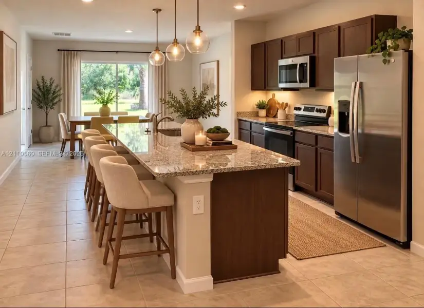 Kitchen featuring a central island with stone countertop, dark wood cabinetry, stainless steel appliances, tile flooring, and glass pendant lighting