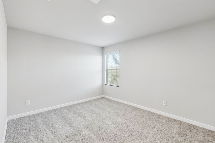 Bedroom in the Haylee home plan by Trophy Signature Homes - REPRESENTATIVE PHOTO