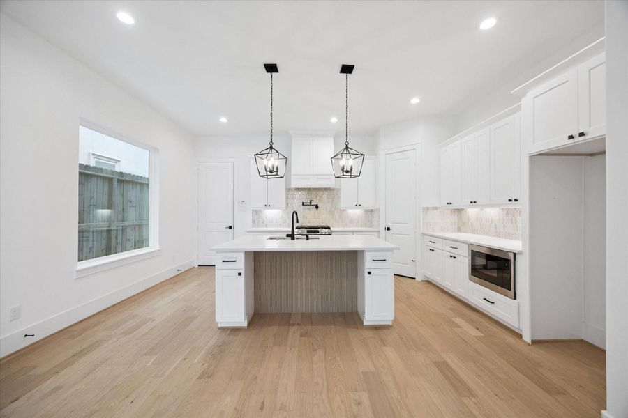 Beautifully designed tile beneath the kitchen island Beautifully designed tile beneath the kitchen island