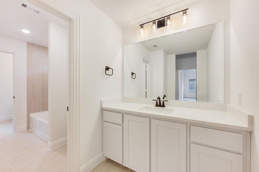 Furnished interior view inside a new home in Windsong Ranch Classic 61, Prosper (Image 15).