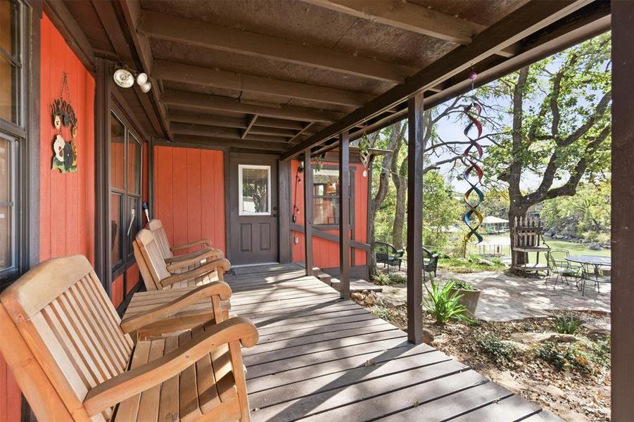 Covered back patio overlooking the lake Covered back patio overlooking the lake
