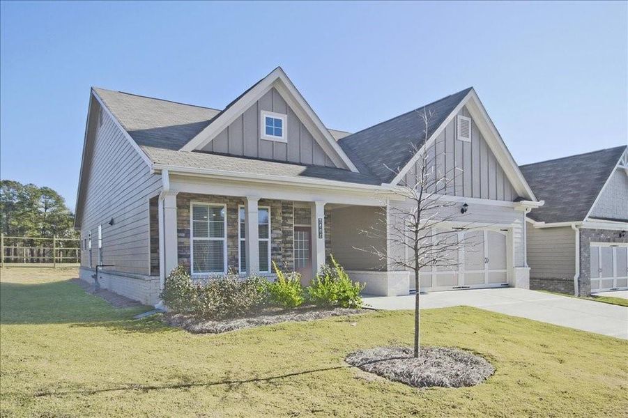 Front exterior of a new home in Cooper's Walk, Loganville, GA, highlighting curb appeal (Image 2). Front exterior of a new home in Cooper's Walk, Loganville, GA, highlighting curb appeal (Image 2).