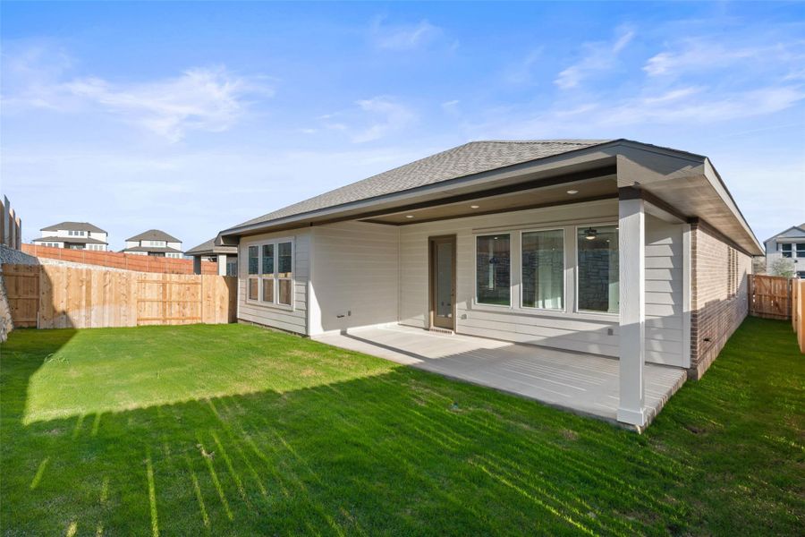 Exterior details and patio area of a home in Lariat, Liberty Hill (Image 24).