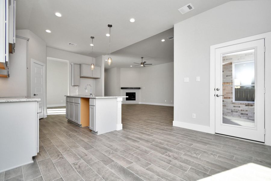 Enjoy breakfast with ease in the connected and cozy breakfast area, seamlessly integrated with the kitchen for utmost convenience. Step through the back door for a breath of fresh air onto the covered patio, extending your living space to the outdoors. Sample photo of completed home with similar plan. As built color and selections will vary. Enjoy breakfast with ease in the connected and cozy breakfast area, seamlessly integrated with the kitchen for utmost convenience. Step through the back door for a breath of fresh air onto the covered patio, extending your living space to the outdoors. Sample photo of completed home with similar plan. As built color and selections will vary.