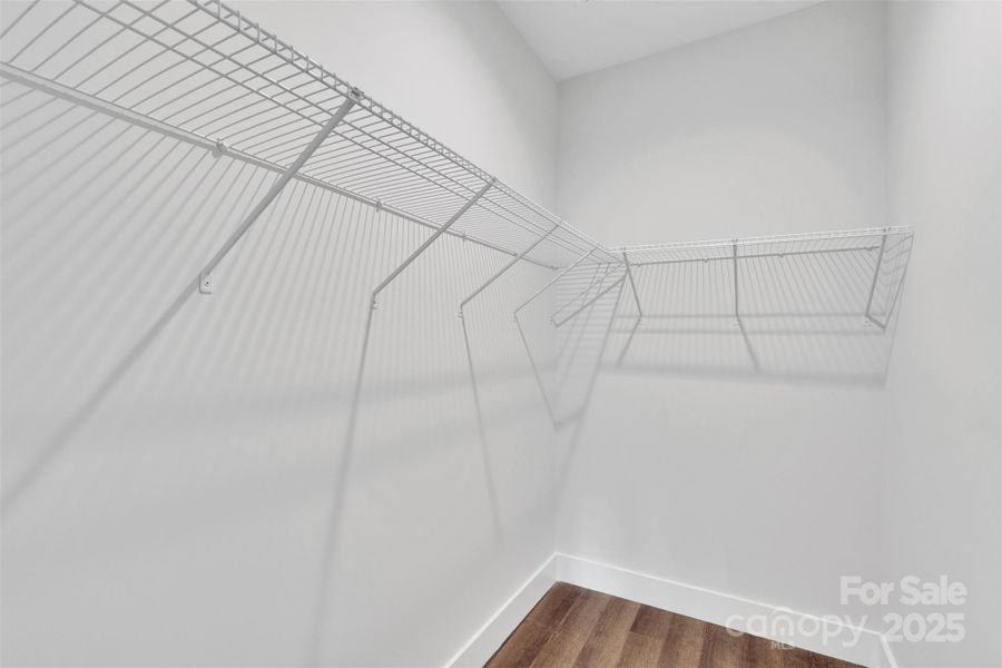 Primary bedroom walk-in closet