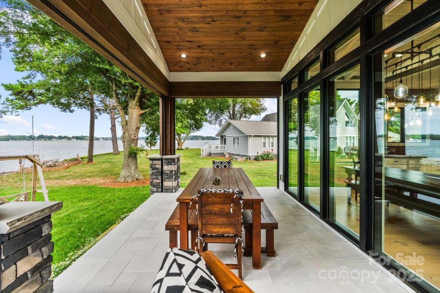 Dine alfresco in your covered, optional screened in patio Dine alfresco in your covered, optional screened in patio