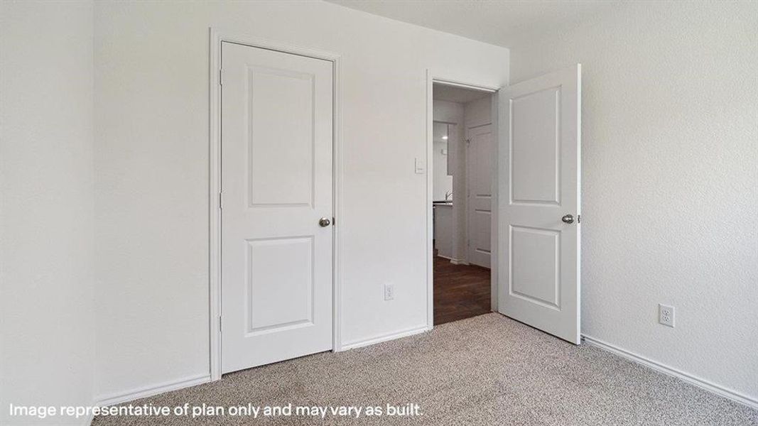 Unfurnished bedroom with carpet and baseboards