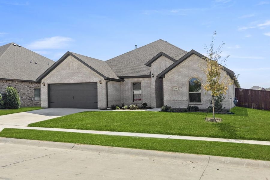 Representative exterior photo of a completed home built from the Hampton by Impression Homes in Timberbrook, Justin, TX (Image 2). Representative exterior photo of a completed home built from the Hampton by Impression Homes in Timberbrook, Justin, TX (Image 2).