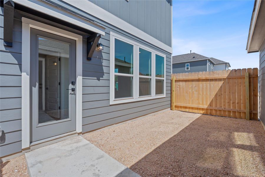 View of exterior entry featuring a patio