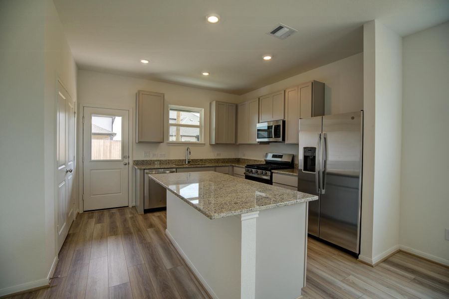 Furnished interior view inside a new home in Mason Woods, Cypress (Image 4).