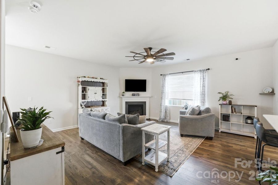 Natural light fills this inviting living space centered around a cozy gas fireplace. Natural light fills this inviting living space centered around a cozy gas fireplace.