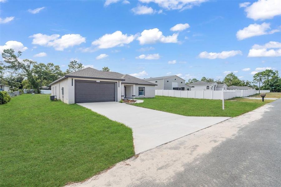 Front exterior of a new home in , Weeki Wachee, FL, highlighting curb appeal (Image 20).