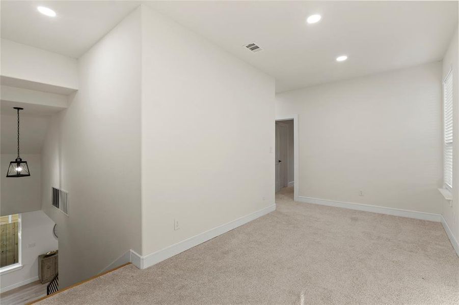 Spare room featuring recessed lighting and light carpet Spare room featuring recessed lighting and light carpet