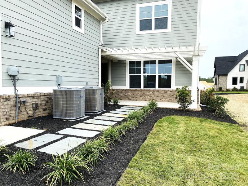 Front exterior of a new home in , Davidson, NC, highlighting curb appeal (Image 2).
