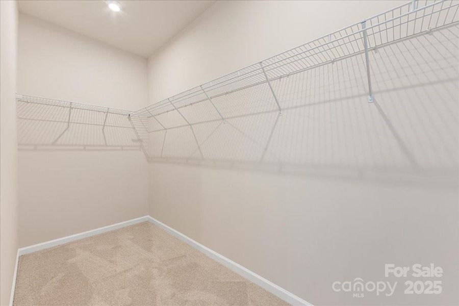 Primary Walk-In Closet. Primary Walk-In Closet.