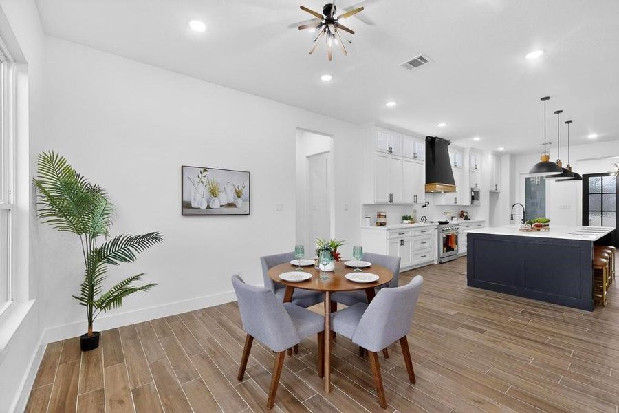 Dining room with wood finish floors and recessed lighting Dining room with wood finish floors and recessed lighting