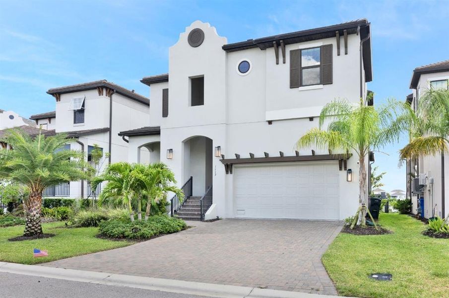 Front exterior of a new home in SouthShore Yacht Club, Ruskin, FL, highlighting curb appeal (Image 2). Front exterior of a new home in SouthShore Yacht Club, Ruskin, FL, highlighting curb appeal (Image 2).
