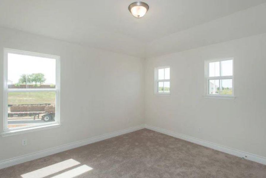 Photo of Pulte home with same floor plan, not of actual home listed.