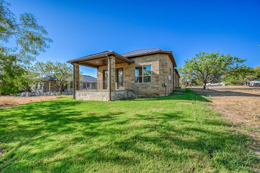 Exterior details and patio area of a home in , Horseshoe Bay (Image 24).