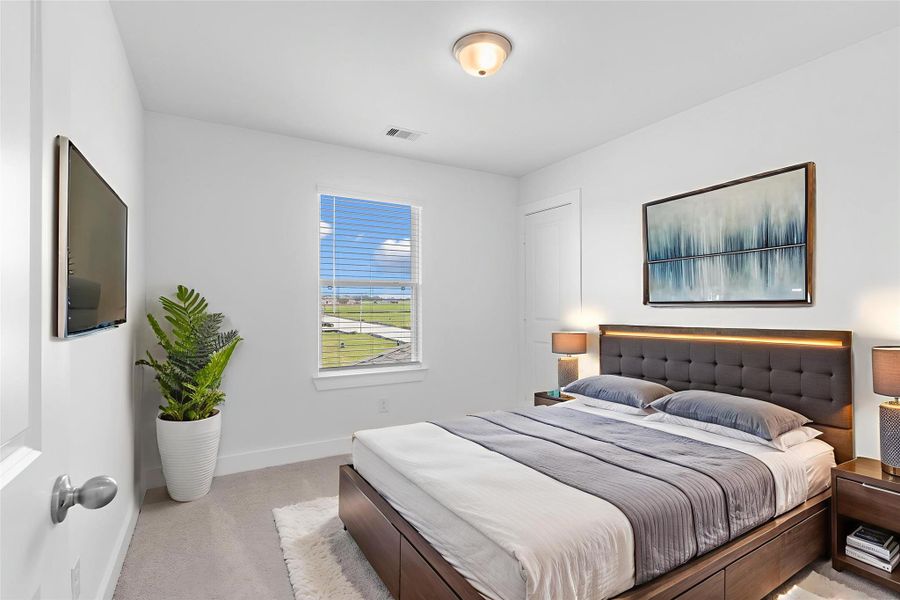 Secondary bedroom with plush carpet, bright natural light, and closet space—ideal for family or guests. All guest bedrooms have outstanding walk in closets. *Virtually Staged* Secondary bedroom with plush carpet, bright natural light, and closet space—ideal for family or guests. All guest bedrooms have outstanding walk in closets. *Virtually Staged*