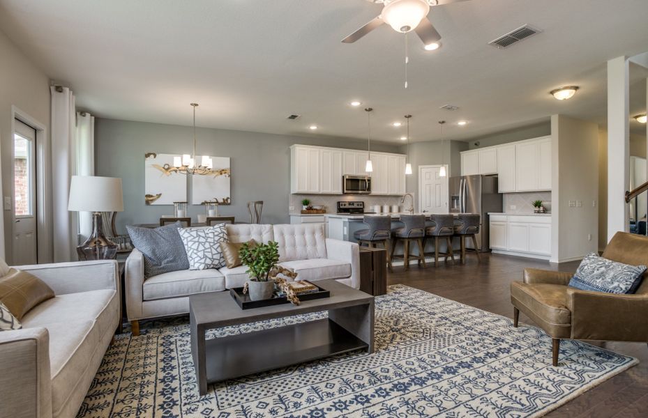 Spacious gathering room with view of kitchen