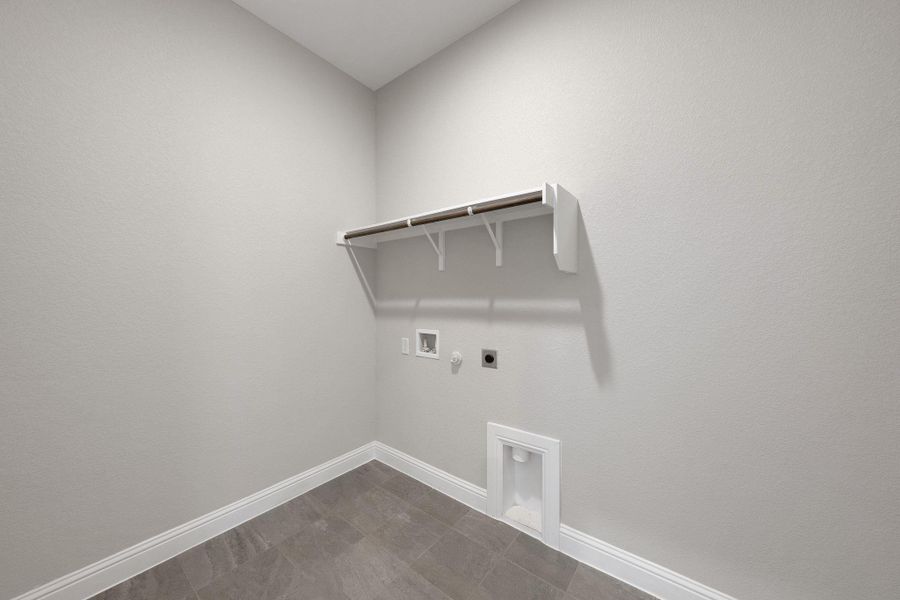 Laundry room with gas dryer hookup, hookup for an electric dryer, and hookup for a washing machine Laundry room with gas dryer hookup, hookup for an electric dryer, and hookup for a washing machine